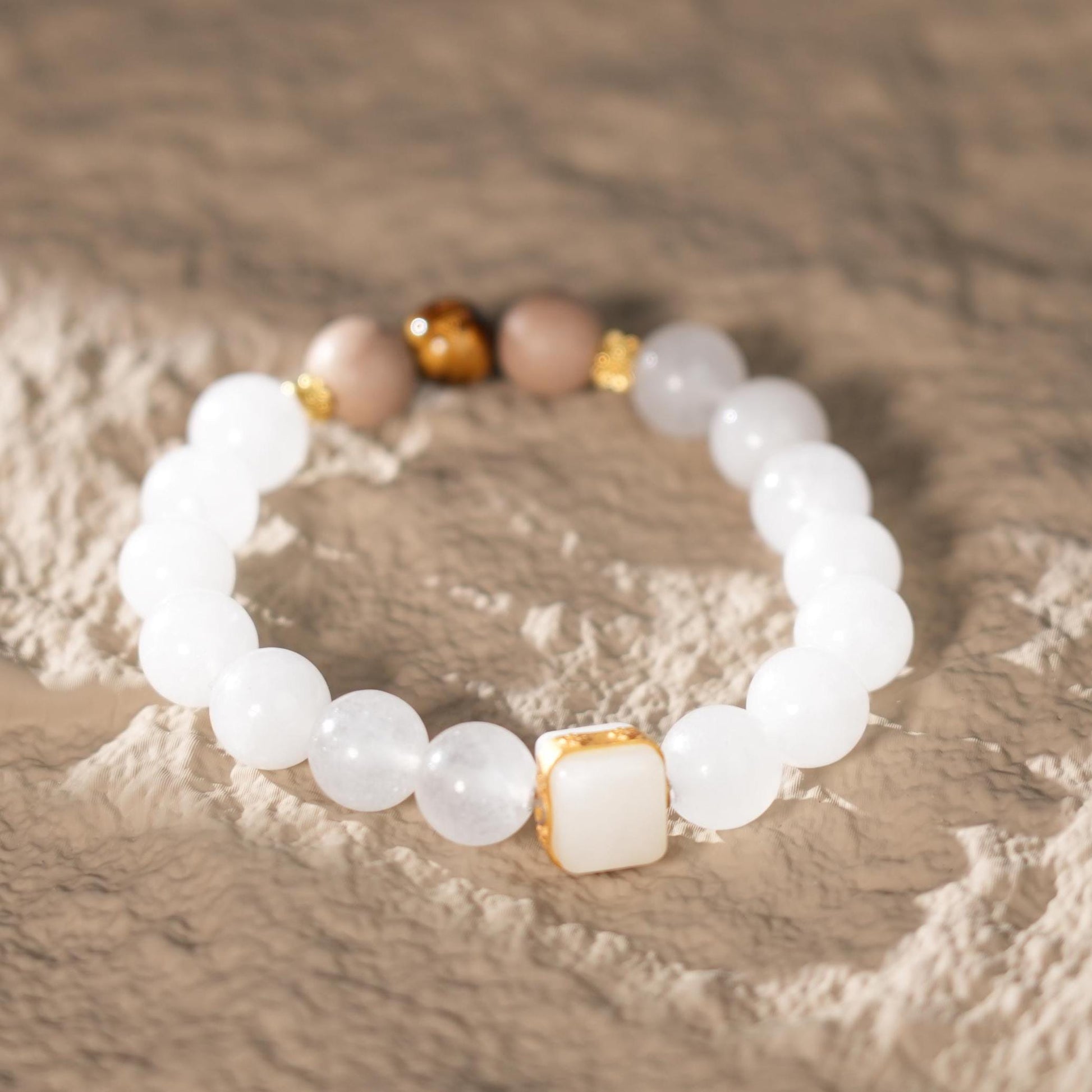 Embrace the power of wisdom and prosperity with this elegant White Jade Bracelet, featuring 10mm White Jade beads infused with Five Elements Metal energy. This spiritual jewelry from Purple Planet brings balance, clarity, and abundance.