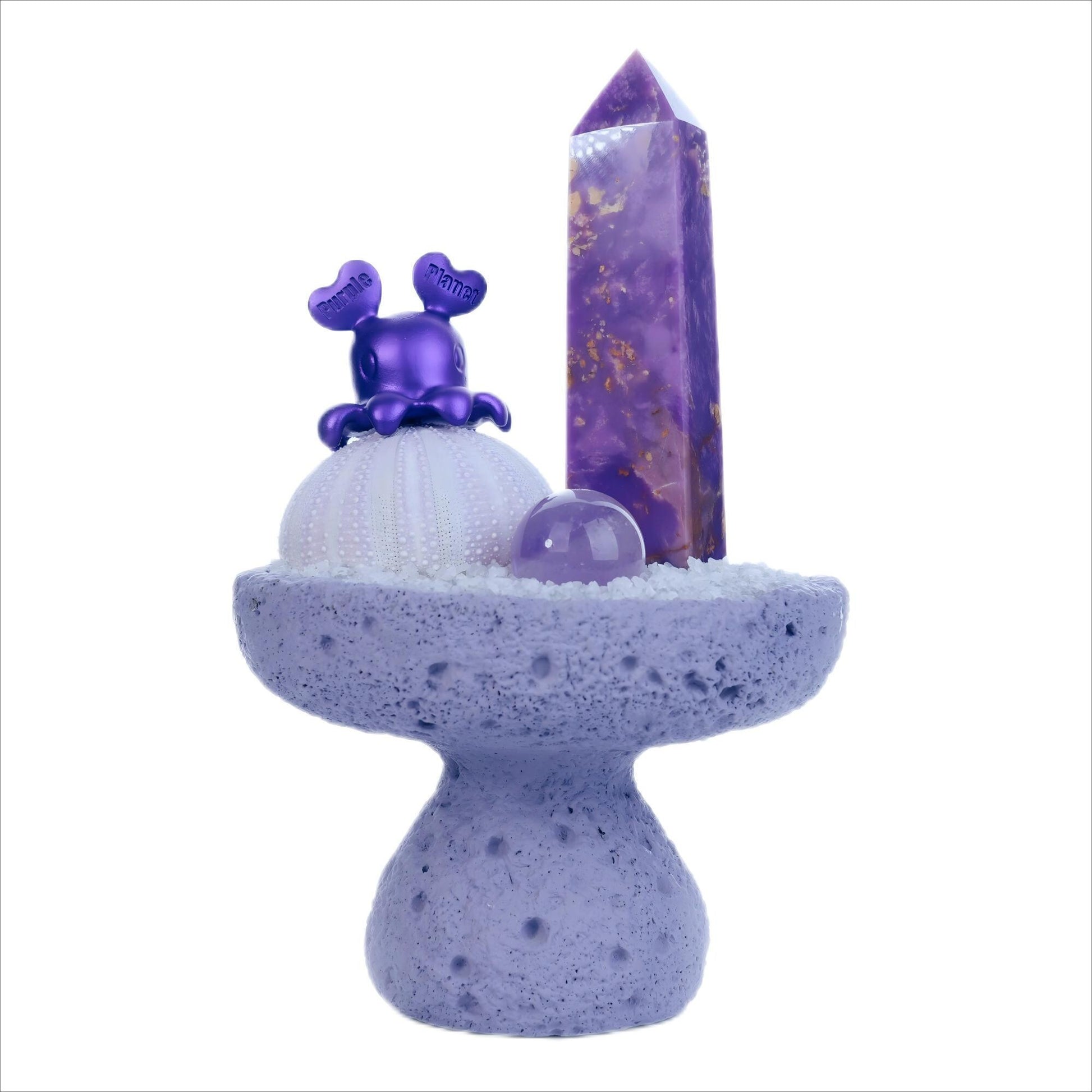 Presenting Mount Sumeru, a spiritual décor piece inspired by the legendary cosmic mountain. This version features a Lepidolite Pillar, known for its calming and healing properties, accompanied by an Amethyst Sphere and Crystal Hunter - Beta Elephant.