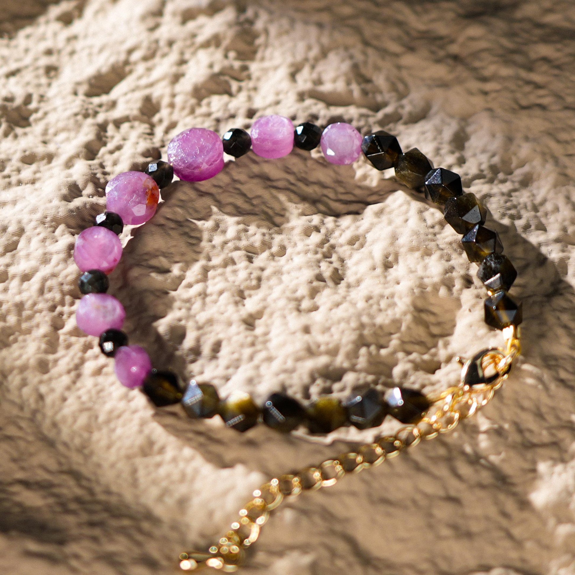 This stunning bracelet features the radiant Star Ruby, a powerful stone known for enhancing spiritual growth and inner strength, alongside the grounding and protective energy of Golden Obsidian.