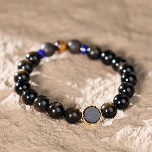 Immerse yourself in the deep, calming energy of the Golden Obsidian Bracelet, featuring a Water Element Aroma Bead paired with Black Onyx. Inspired by the flow of water, this bracelet symbolizes mystery, wisdom, and inner tranquility.