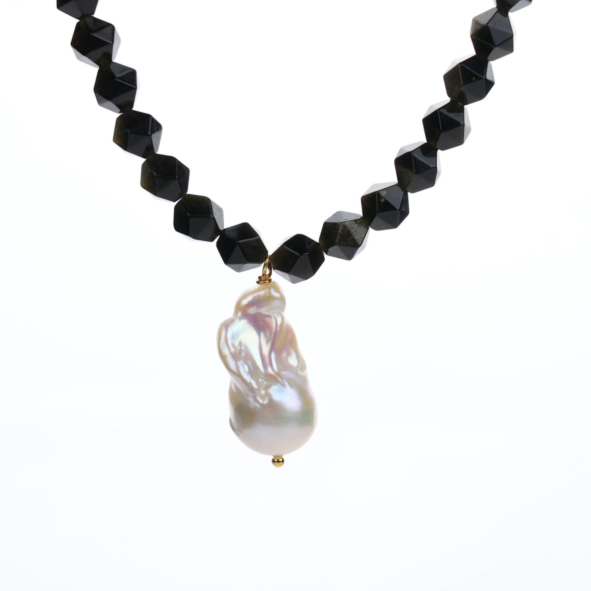 Featuring faceted 8mm Golden Obsidian beads, known for their protective and grounding energy, and a one-of-a-kind Baroque Pearl pendant, this necklace brings together beauty and individuality.