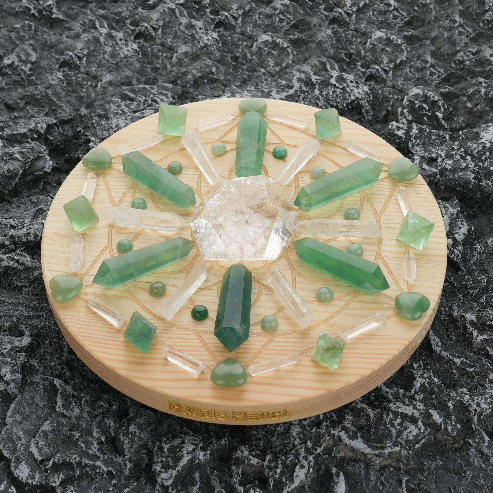 Featuring a harmonious arrangement of Green Fluorite, Green Aventurine, and Clear Quartz on a 9.8-inch Prosperity/Healing Crystal Grid, this set is designed to channel powerful energies for growth, abundance, and inner clarity.