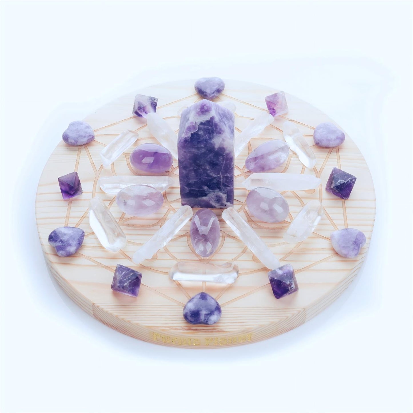 Handcrafted with Lepidolite, Amethyst,  Purple Fluorite, and Clear Quartz, this crystal grid set is designed to soothe the mind, uplift the spirit, and promote deep emotional healing.