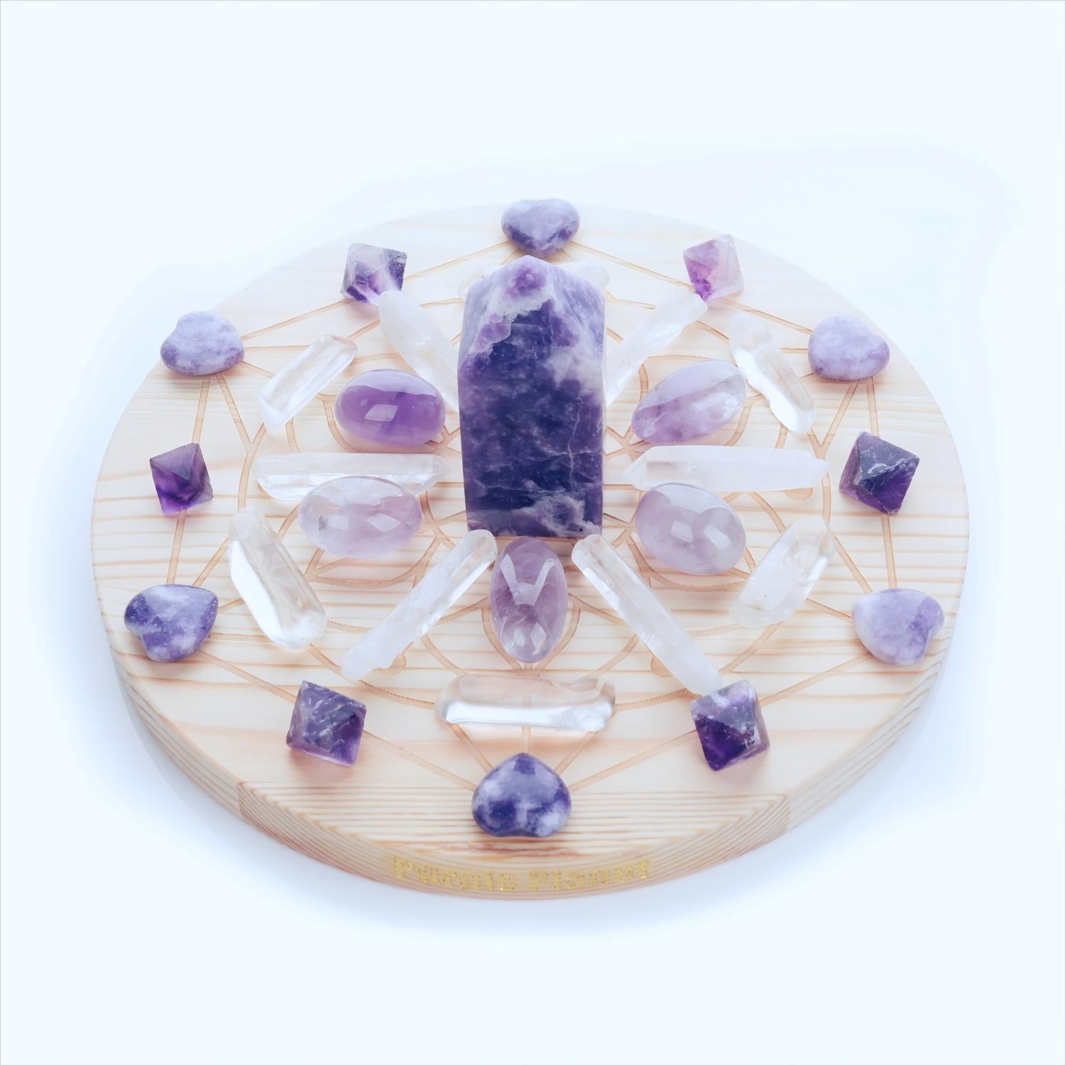 Handcrafted with Lepidolite, Amethyst,  Purple Fluorite, and Clear Quartz, this crystal grid set is designed to soothe the mind, uplift the spirit, and promote deep emotional healing.