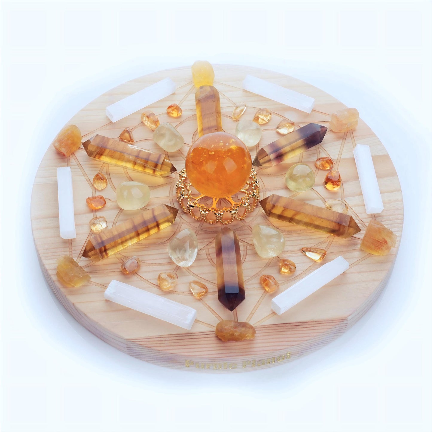 Featuring Citrine, Golden Mica Rabbit Hair Fluorite, Lemon Quartz, and Yellow Fluorite, this crystal grid set is designed to boost confidence, manifest wealth, and uplift your spirit. Arranged on a 9.8-inch Sacred Geometry pinewood grid.